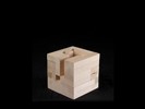 Photograph of bass wood cube model with shifted portions of the cube.