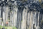 Student in front of basalt columns.