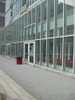 Photo of another building with rectangular forms seen through the window.