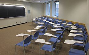 A view of the recitation room, looking toward the chalkboard from the end of one of the rows of chairs.