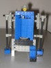 Another humanoid robot, with an actual Lego head on top, and arms extending down to the ground.