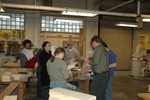 Students review historic designs in preparation for laying out a preliminary design on their own wooden model.