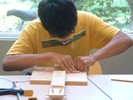 Student working on their guitar.