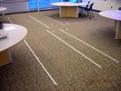 White strips of tape on the floor denote energy levels.